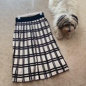 Black and white pleated skirt, matches Ruffus!